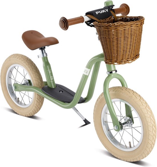 Retro groene Puky LR XL loopfiets met rieten mandje voor kinderen vanaf 3 jaar